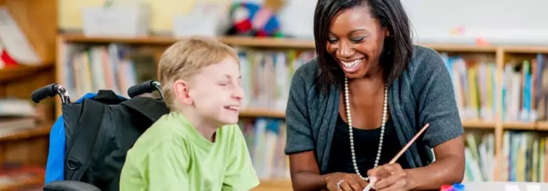 learndirect - social worker with young boy, fulfilling 
