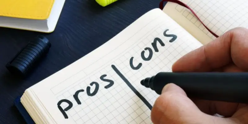 Pros And Cons Written In A Notepad