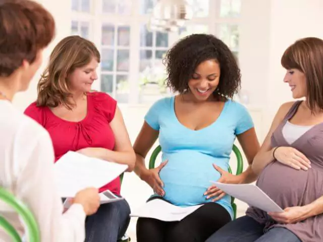 pregnant women sat in a circle