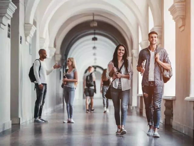 students walking in university corridor