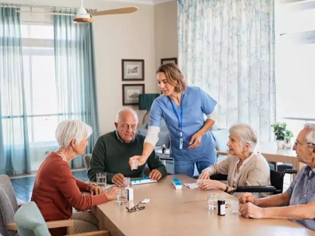 nurse giving medication to patients