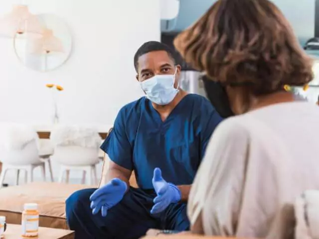 nurse talking to patient