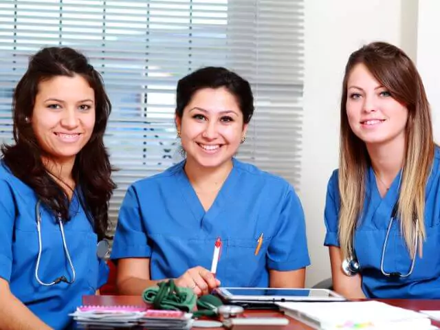 three nurses studying