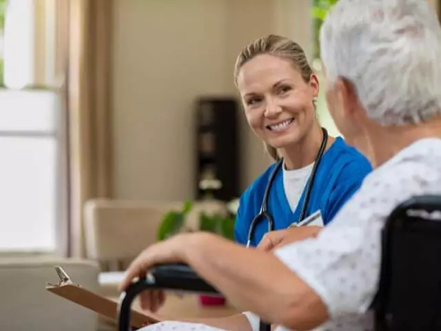 nurse talking to patient