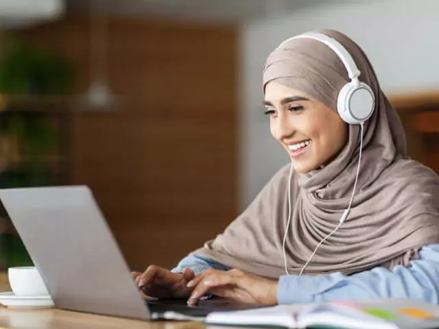 woman studying on laptop