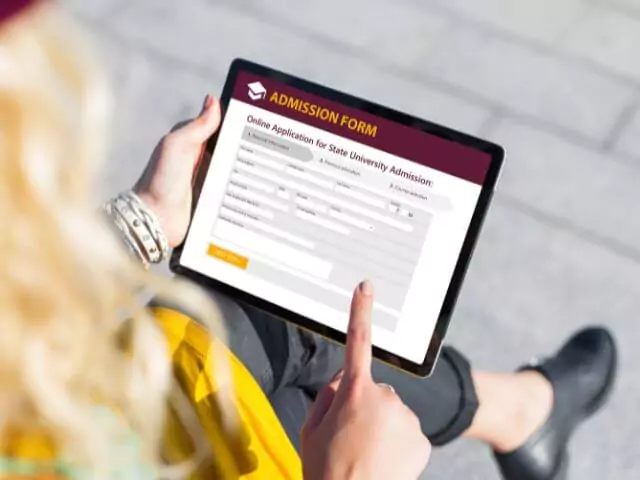 woman submitting application on tablet
