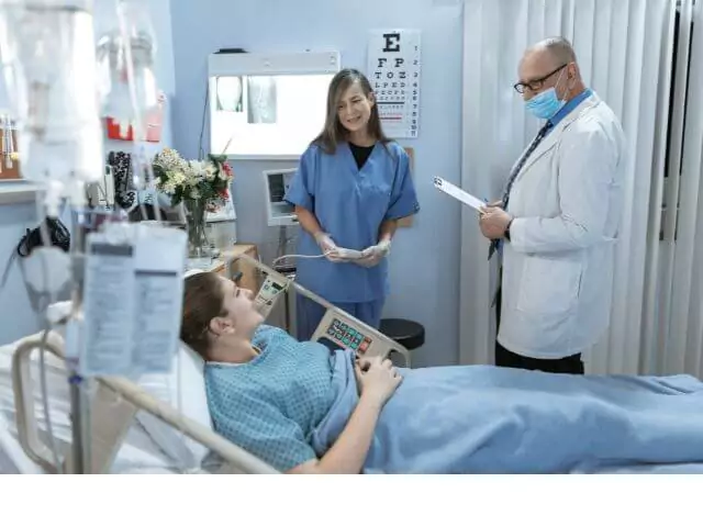 doctor and nurse talking to paitent in accident and emergency