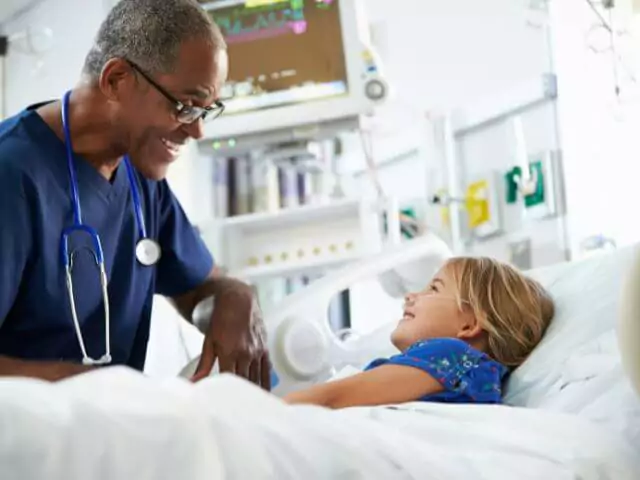 nurse talking to girl patient