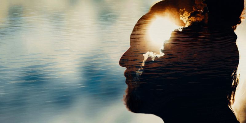 shadow of mans head with sun shining from it