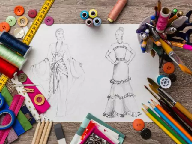 dress desinged on paper with coloured pencils around it