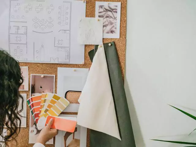 How To Become An Interior Designer (designer-creating-mood-board.webp)