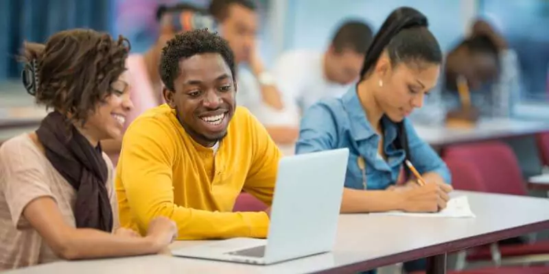 university students studying on laptop