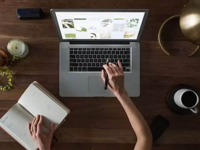 woman studying on laptop at desk