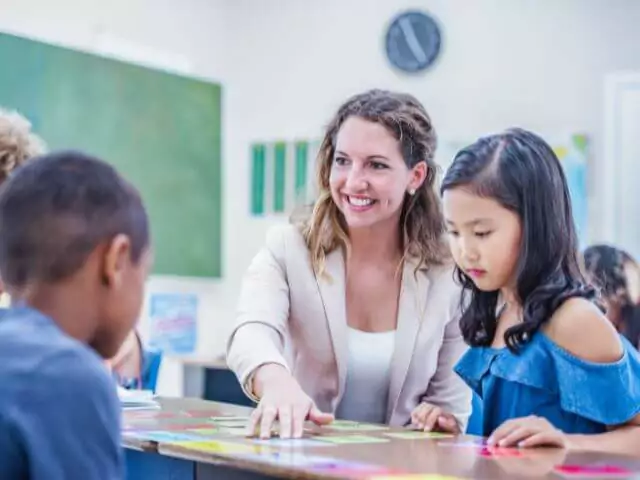 woman teaching english to foreign students