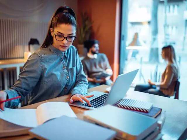 woman studying on laptop