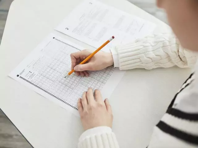 Female Filling In Exam Paper