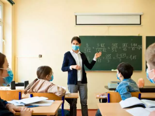 Woman Teaching Maths To Children