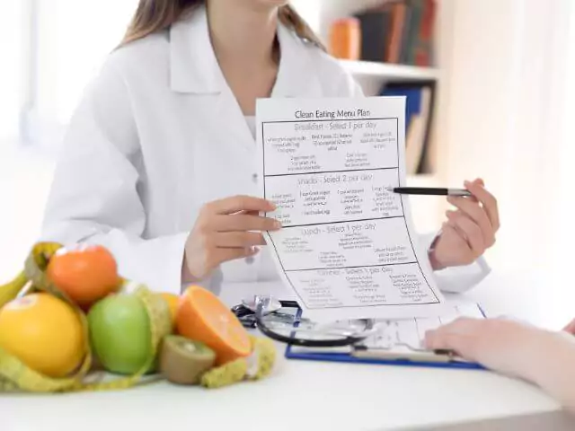 nutritionist holding meal plan