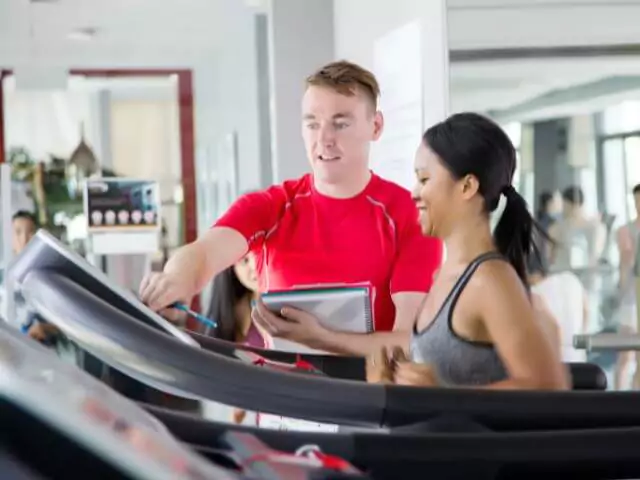 What Is The Right Personal Training Course For You? (personal-trainer-teaching-woman-on-treadmill.webp)