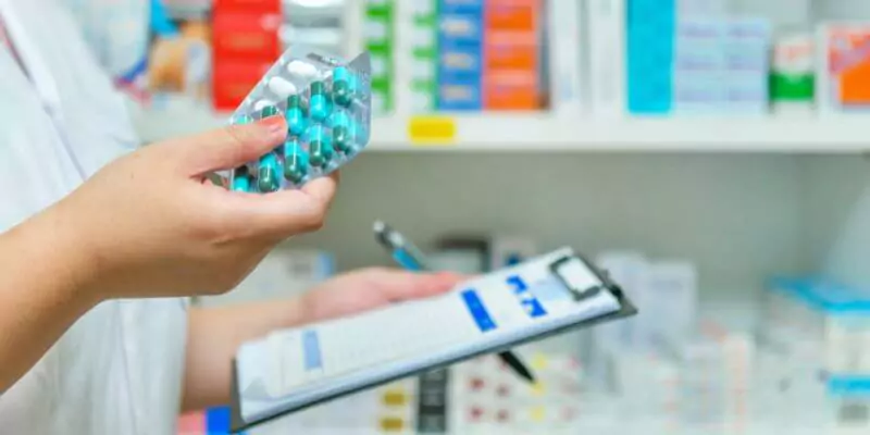 pharmacist holding tablets