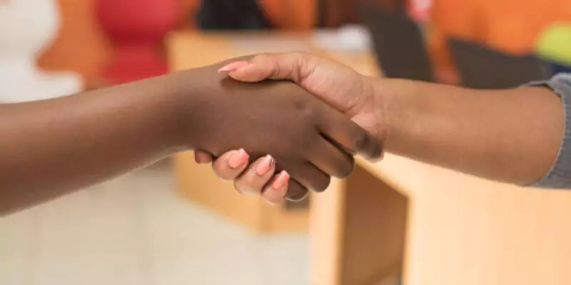 women shaking hands