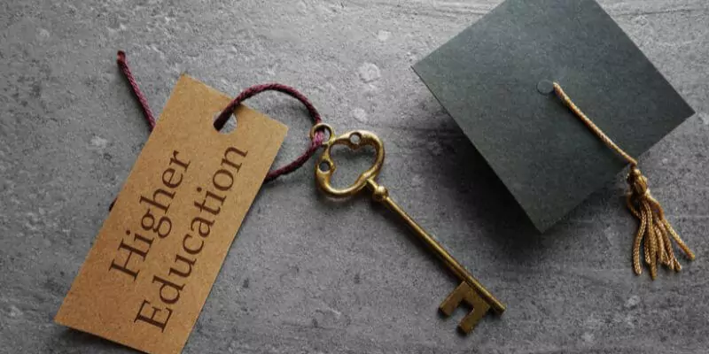 key attached to tag reading higher education next to graduation cap