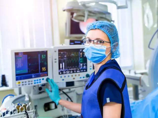 Critial Care Nurse Setting Up Monitors