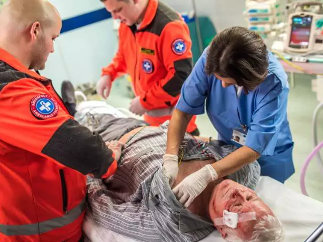 Nurse And Emergency Staff Treating Patient