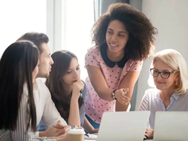 Female Mentor Teaching Group of Students