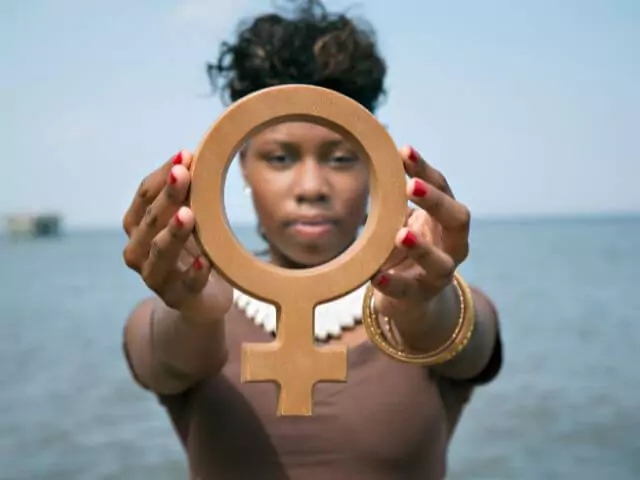 Woman Holding Female Symbol