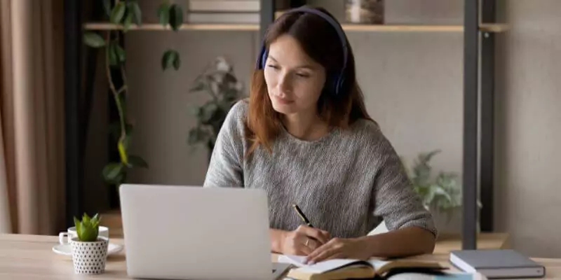 woman studying online course on laptop