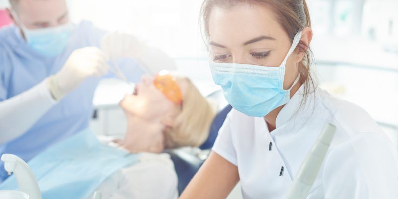 How Much Does A Dental Nurse Earn? (dental-nurse-working.jpg)